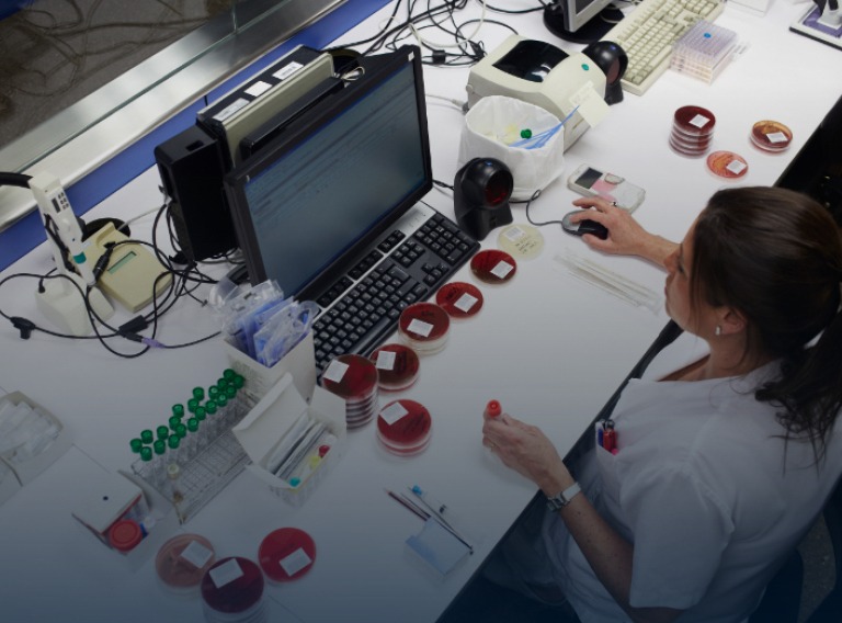 lab technician using lenovo computer