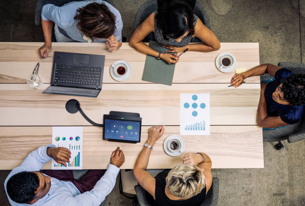 4 people working at a table