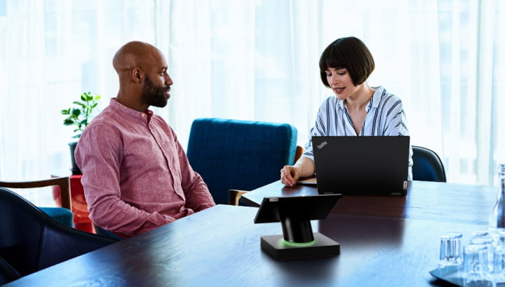 Man and woman talking at table